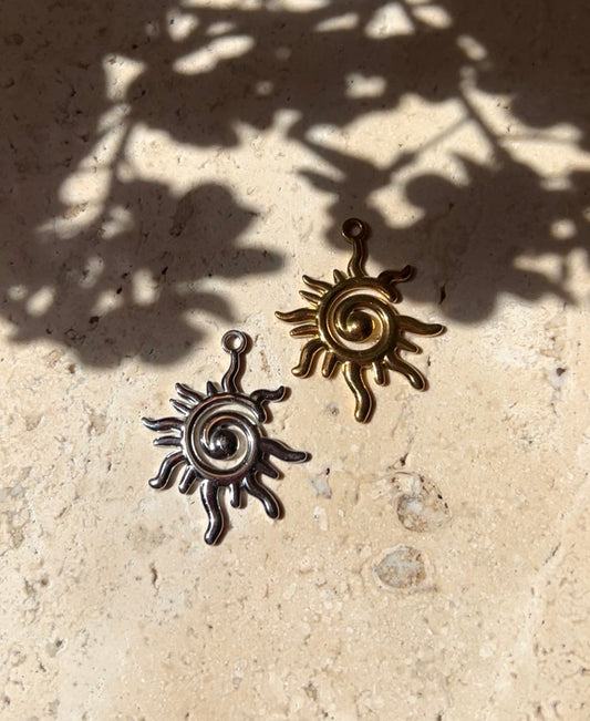 Sun whirl charm